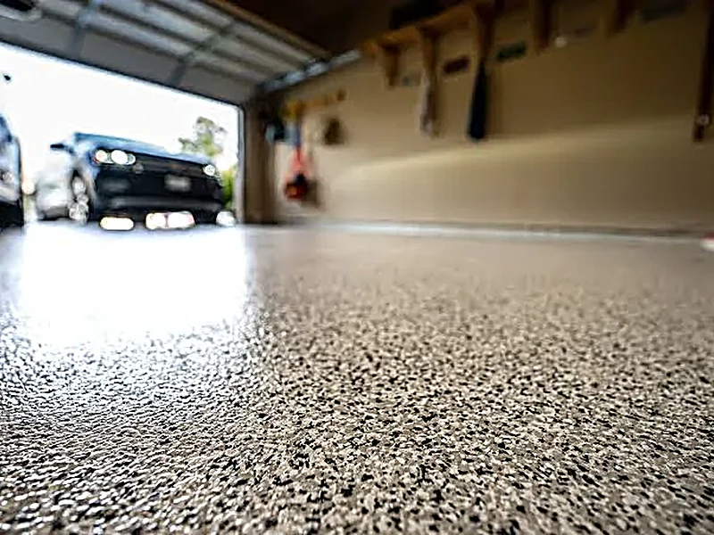Gray speckle epoxy floor coating in a Boise garage
